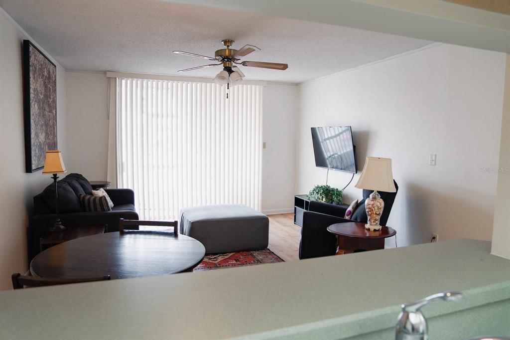 519 Albee Farm Road, Unit 110 Venice, FL 34285 - Photo 27 of 33 a living room with furniture and a potted plant