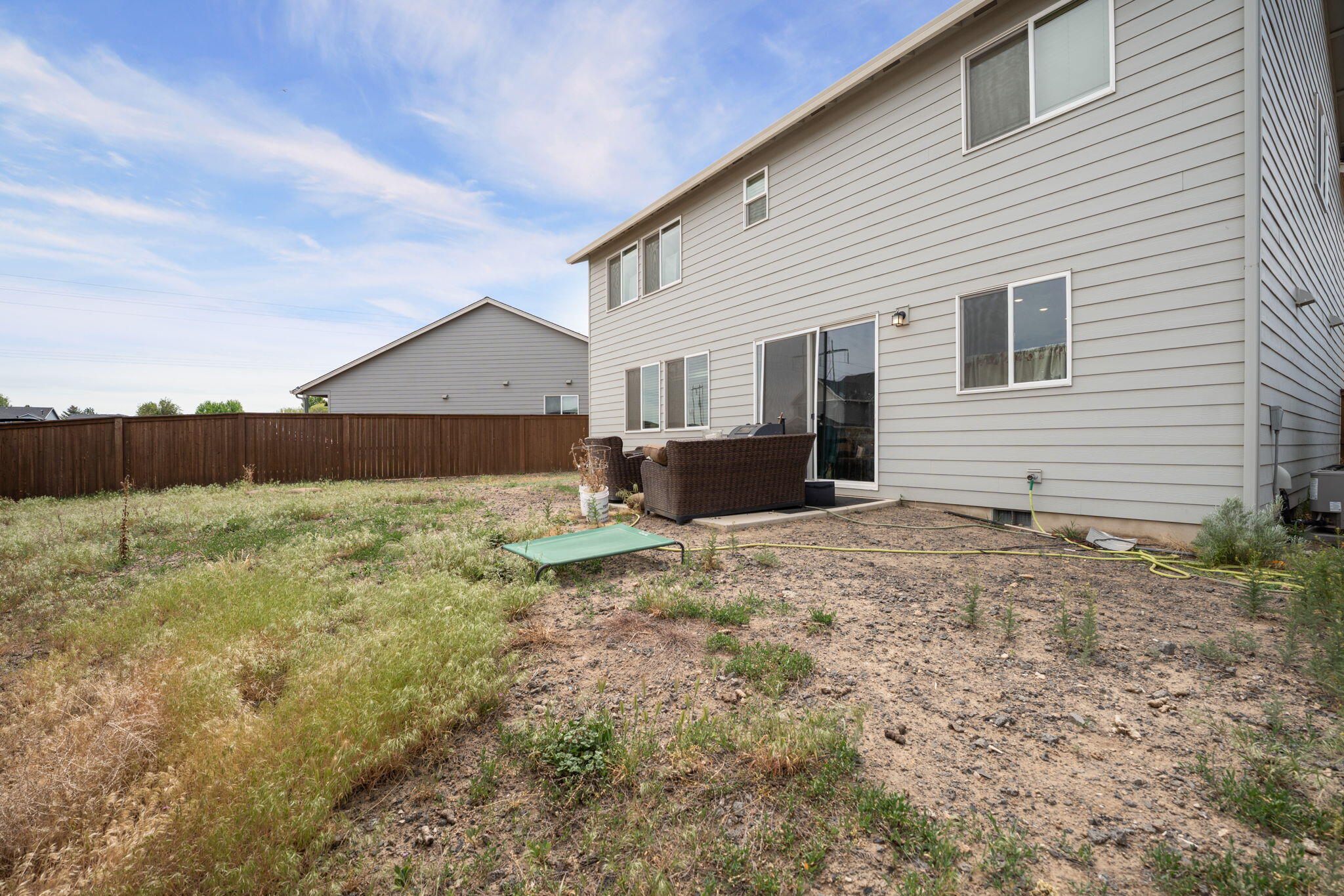 4039 Southwest Quartz Place Redmond, OR 97756 - Photo 42 of 44 a view of a house with backyard and couches