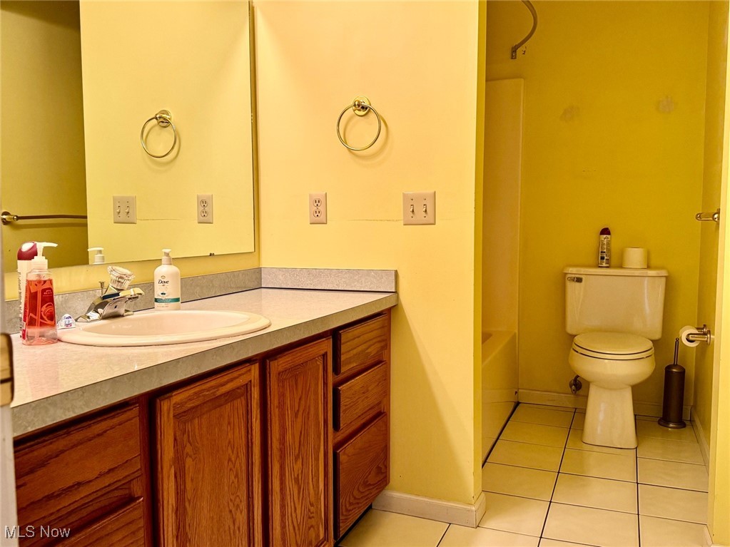 1467 Bennett Road Madison, OH 44057 - Photo 25 of 26 Bathroom with vanity, tile patterned flooring, and toilet