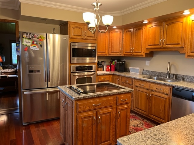 5833 South Skare Road Rochelle, IL 61068 - Photo 12 of 41 a kitchen with stainless steel appliances granite countertop a refrigerator and a sink