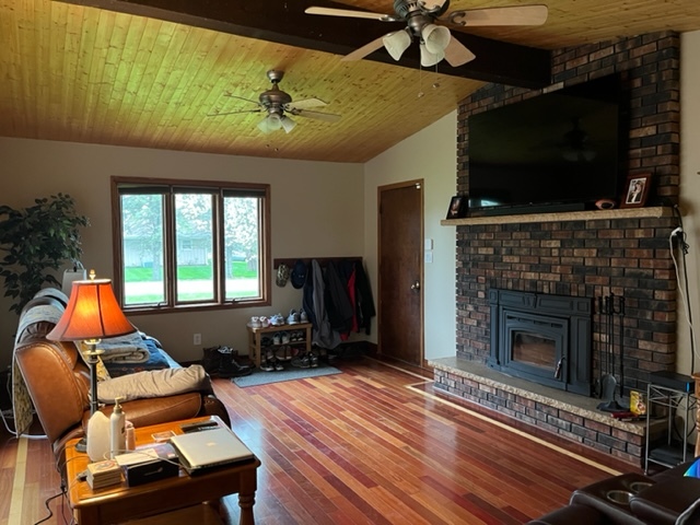 5833 South Skare Road Rochelle, IL 61068 - Photo 17 of 41 a living room with furniture fireplace and flat screen tv