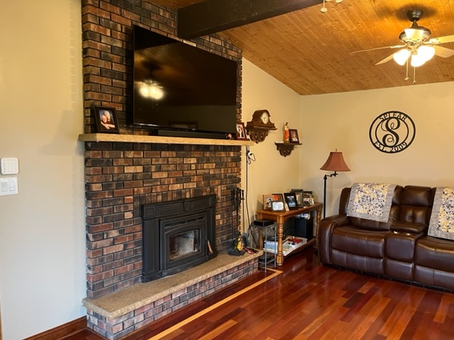 5833 South Skare Road Rochelle, IL 61068 - Photo 18 of 41 a living room with furniture and a fireplace