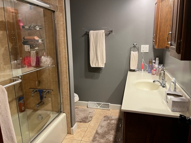 5833 South Skare Road Rochelle, IL 61068 - Photo 19 of 41 a bathroom with a sink and a mirror