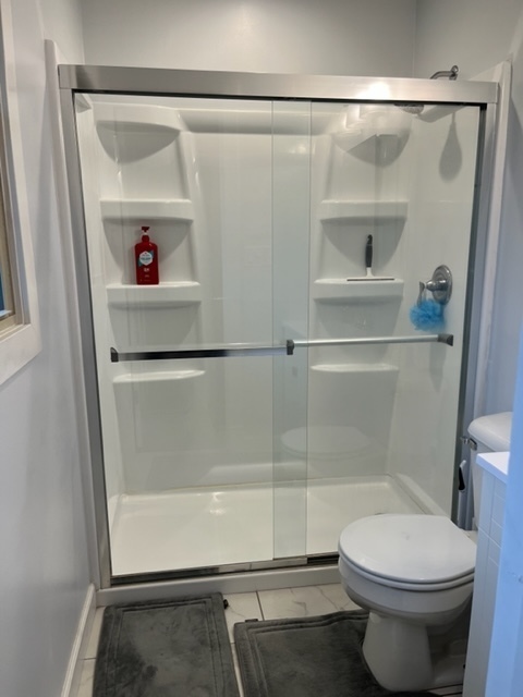 5833 South Skare Road Rochelle, IL 61068 - Photo 23 of 41 a bathroom with a shower and a toilet