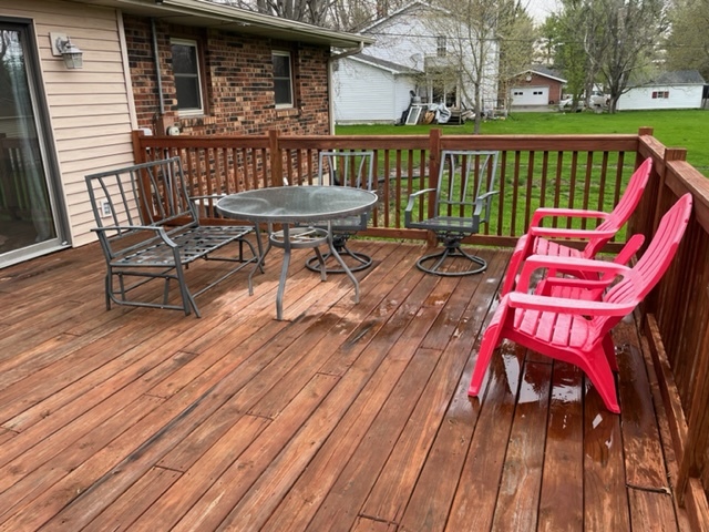 5833 South Skare Road Rochelle, IL 61068 - Photo 36 of 41 a view of a deck with wooden floor and outdoor seating