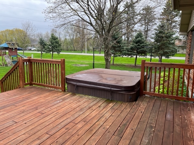 5833 South Skare Road Rochelle, IL 61068 - Photo 37 of 41 a view of a wooden deck with a yard and wooden fence