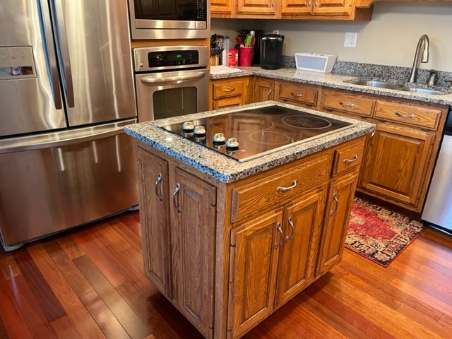 5833 South Skare Road Rochelle, IL 61068 - Photo 8 of 41 a kitchen with granite countertop a sink and a stove top oven