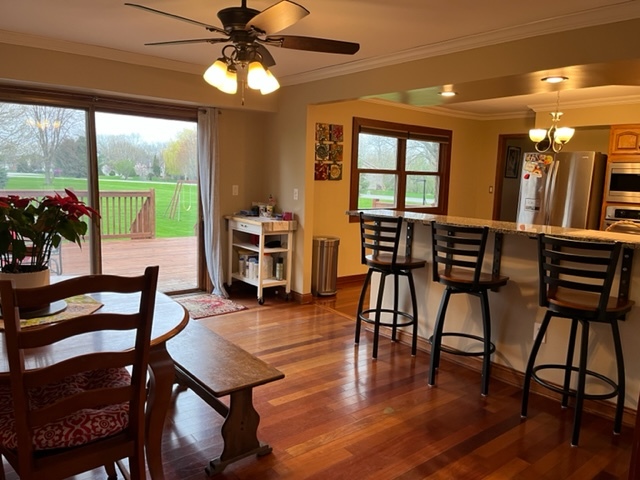 5833 South Skare Road Rochelle, IL 61068 - Photo 10 of 41 a view of a dining room with furniture window and wooden floor