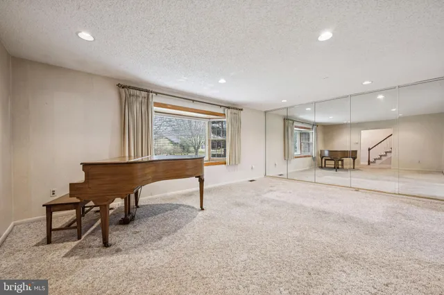 a living room with furniture a window and a table