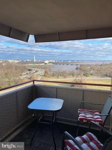 a street sign that is sitting in front of flowers