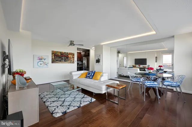 a bedroom with furniture and a flat screen tv