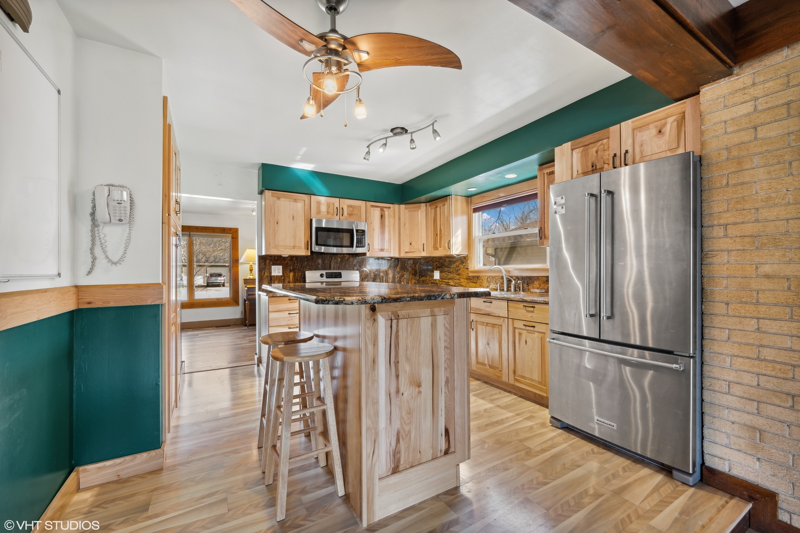 4507 Gettysburg Drive Rolling Meadows, IL 60008 - Photo 6 of 25 a kitchen with stainless steel appliances granite countertop a refrigerator a stove top oven a sink dishwasher and white cabinets with wooden floor