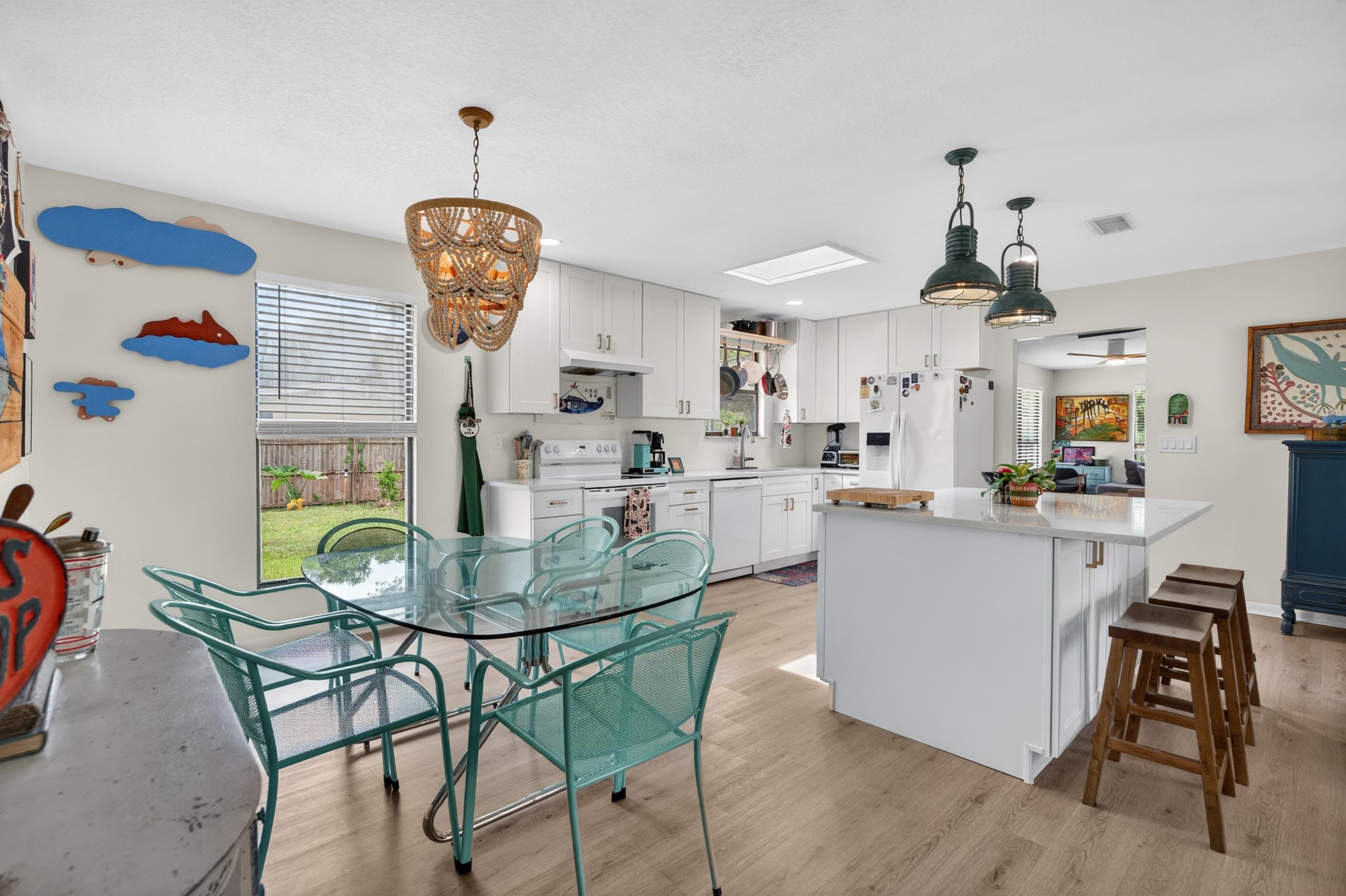 111 Pompano Road St. Augustine, FL 32086 - Photo 14 of 61 a dining room filled chandelier and wooden floor