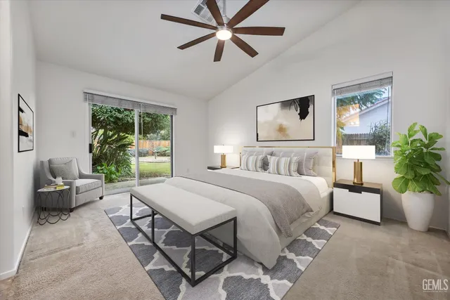 a spacious bedroom with a bed a couch and a window