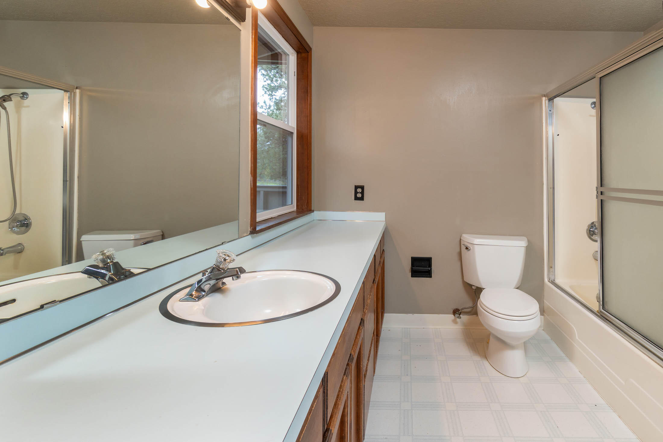 20316 Donkey Sled Road Bend, OR 97702 - Photo 22 of 50 a bathroom with a sink a toilet and mirror