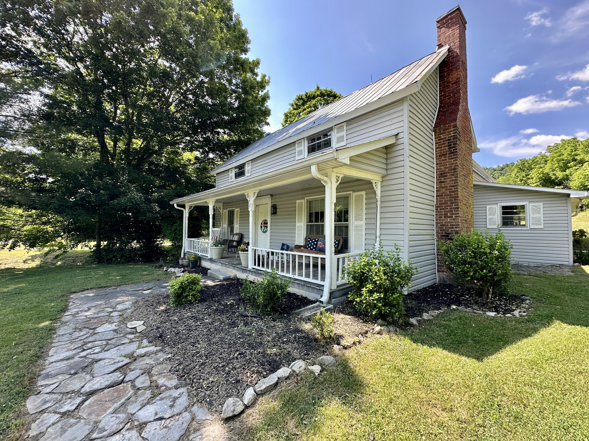 3437 Wolf Creek Road Silver Point, TN 38582 - Photo 5 of 70 a view of a house with backyard sitting area and garden