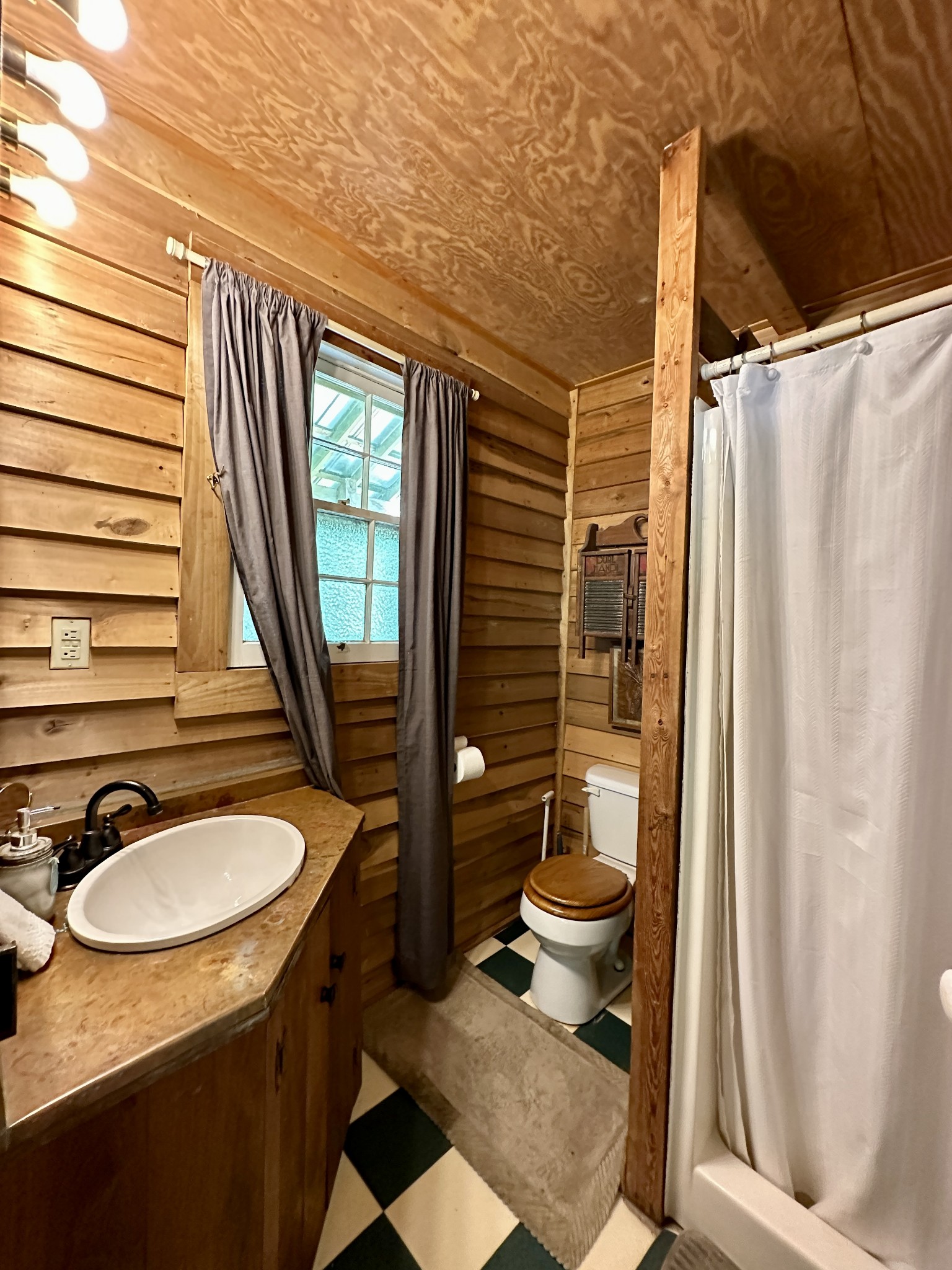 3437 Wolf Creek Road Silver Point, TN 38582 - Photo 58 of 70 a bathroom with a sink toilet and shower