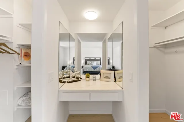 a view of living room with furniture and wooden floor