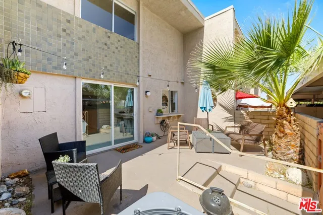 a building outdoor space with patio furniture