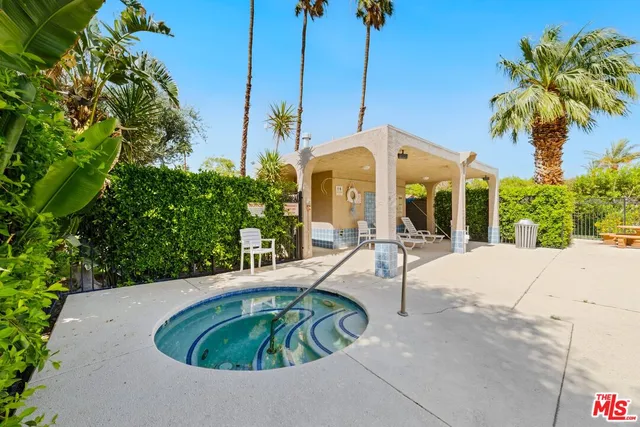 a view of a swimming pool with a sitting area