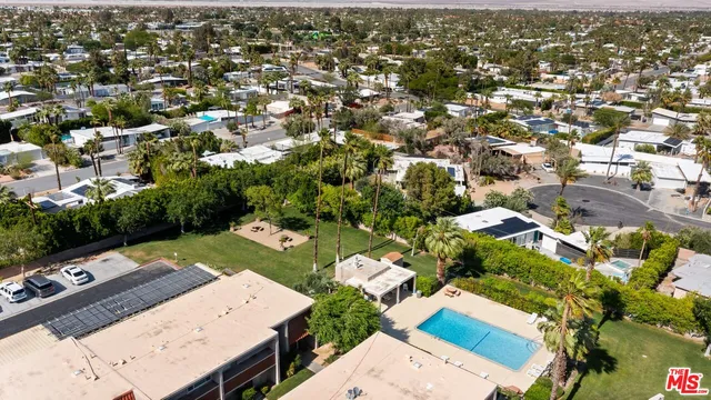 an aerial view of a residential houses with outdoor space