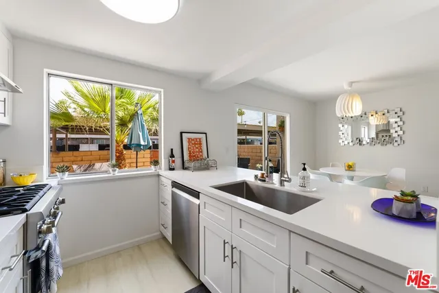 a kitchen with a sink and a window