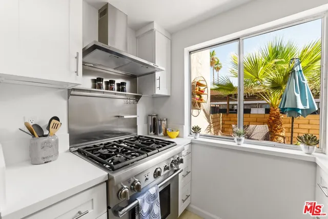 a kitchen with a stove and a sink