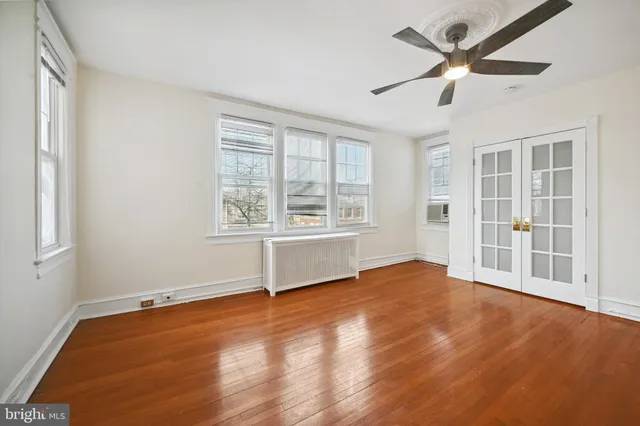 a view of an empty room with a window