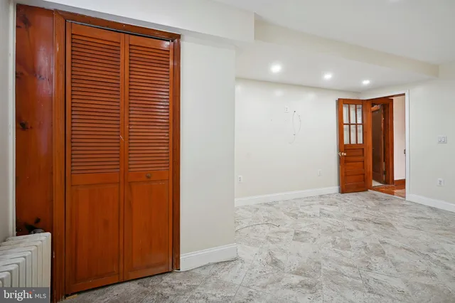 a kitchen with stainless steel appliances granite countertop a sink a stove and cabinets