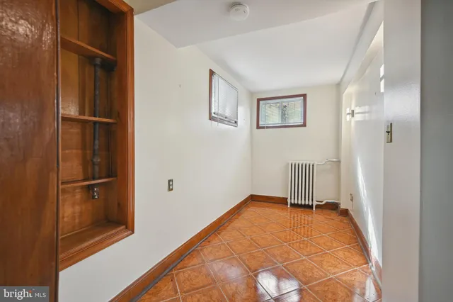 a bathroom with a toilet a sink and a mirror