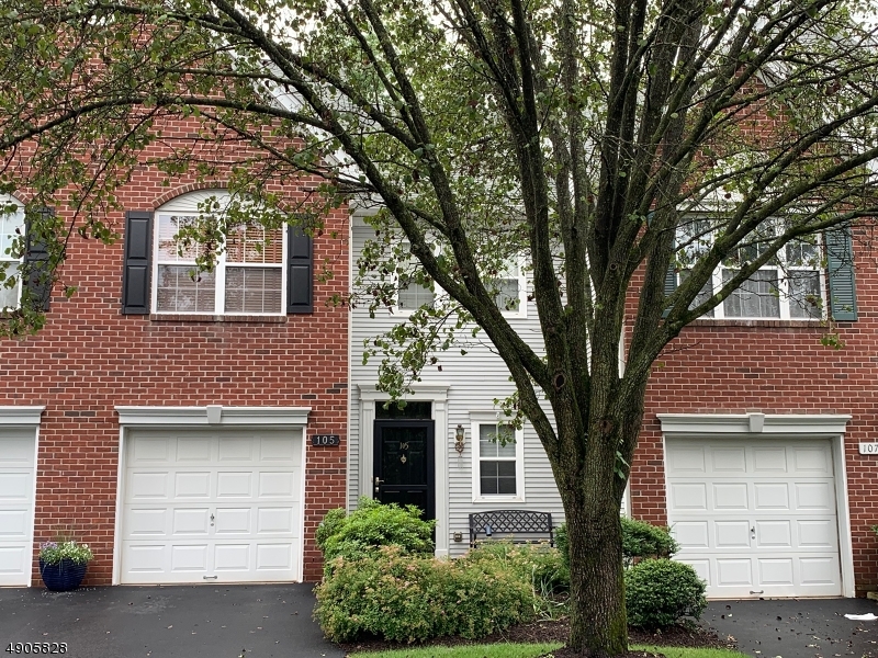 105 Well Sweep Road, Unit 105 Whitehouse Station, NJ 08889 - Photo 18 of 22 a front view of a house with a tree
