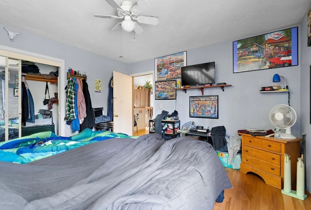 6 Plum Tree Lane Hubbardston, MA 01452 - Photo 16 of 31 a bedroom with furniture and a flat screen tv