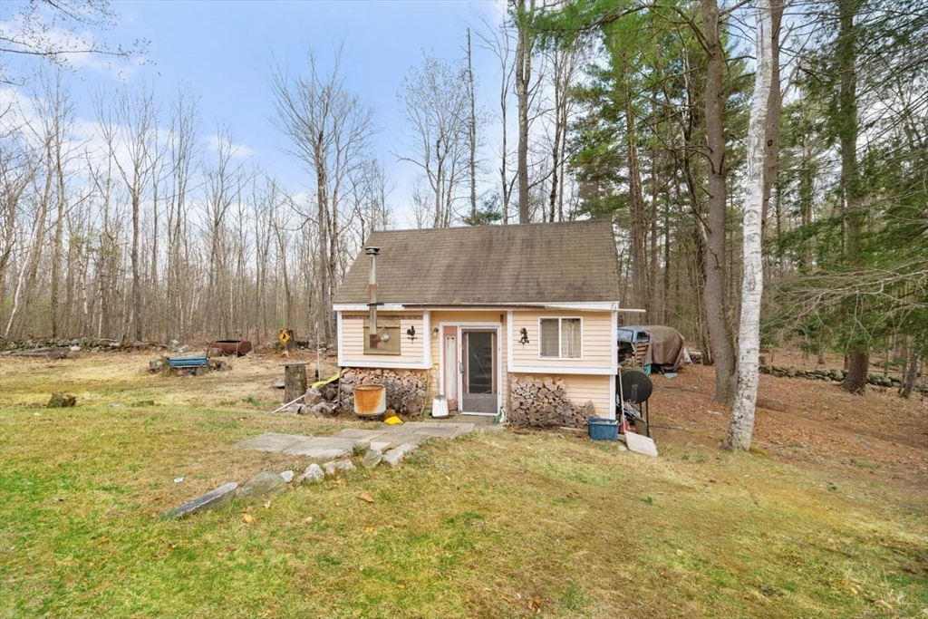 6 Plum Tree Lane Hubbardston, MA 01452 - Photo 23 of 31 a view of a house with a yard covered in snow