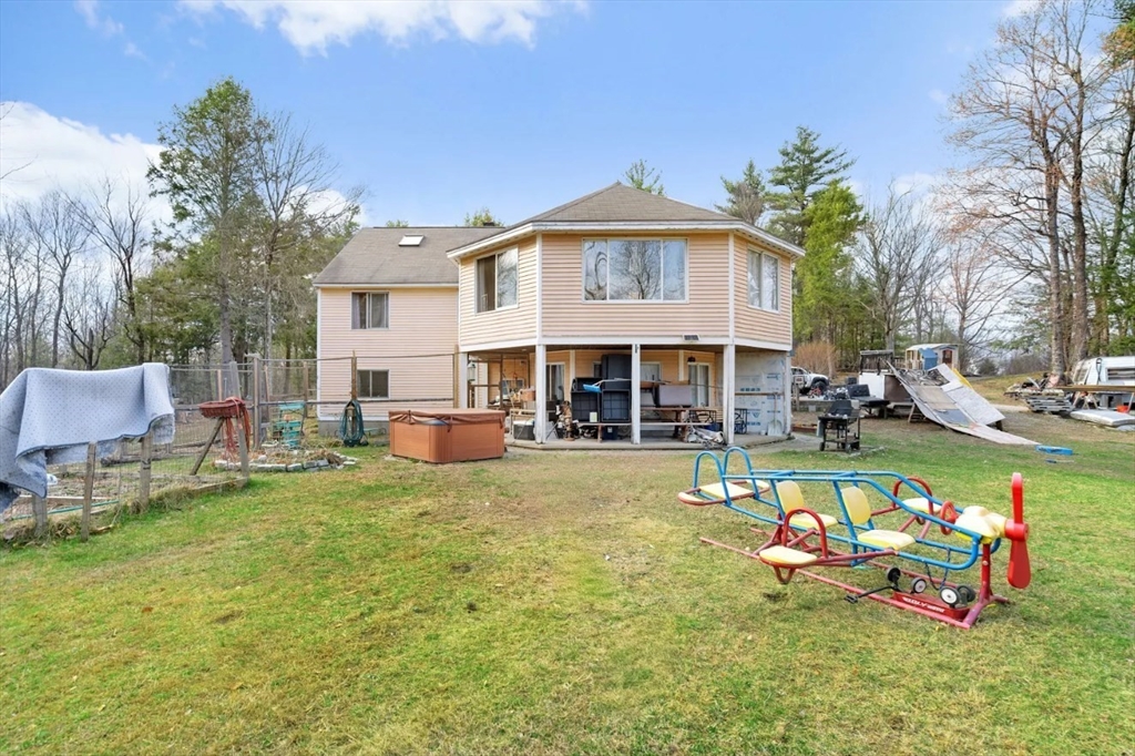 6 Plum Tree Lane Hubbardston, MA 01452 - Photo 24 of 31 a front view of a house with swimming pool having outdoor seating