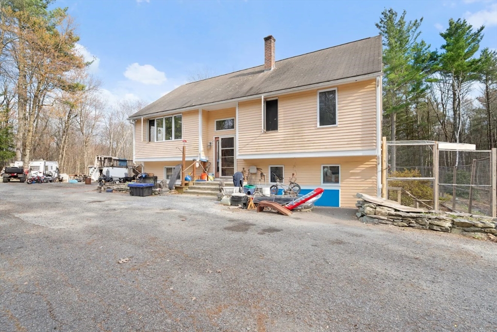 6 Plum Tree Lane Hubbardston, MA 01452 - Photo 3 of 31 a view of a house with backyard