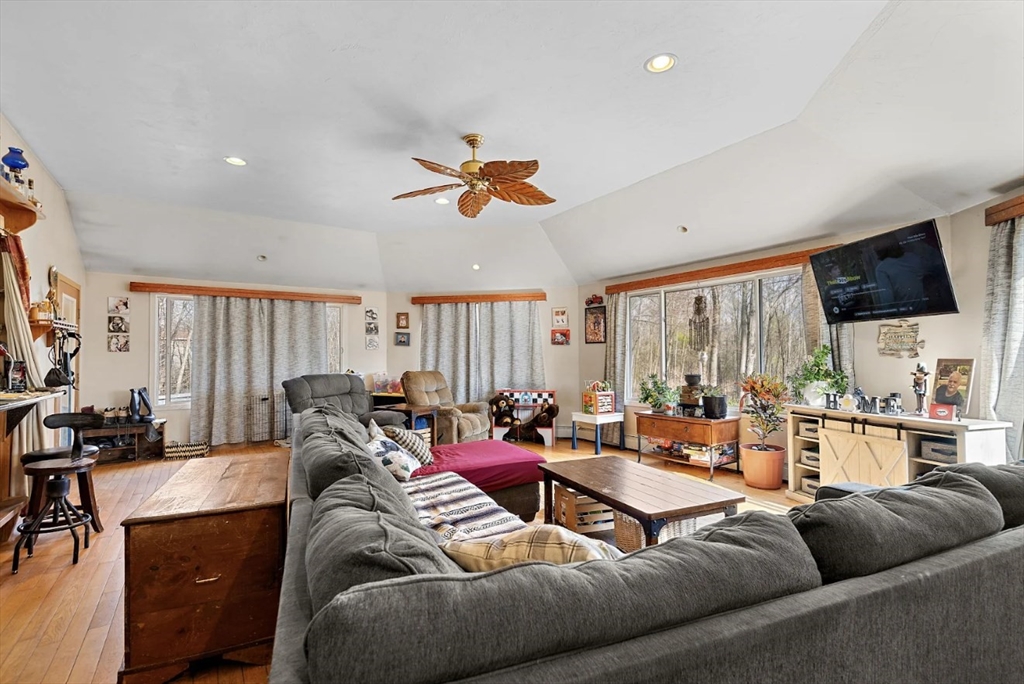 6 Plum Tree Lane Hubbardston, MA 01452 - Photo 4 of 31 a living room with furniture ceiling fan and a large window