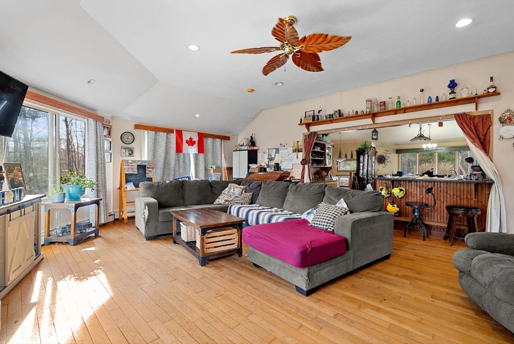 6 Plum Tree Lane Hubbardston, MA 01452 - Photo 6 of 31 a living room filled with furniture and a flat screen tv