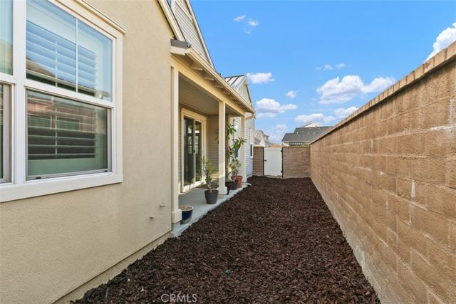 a view of a pathway of a house with a yard