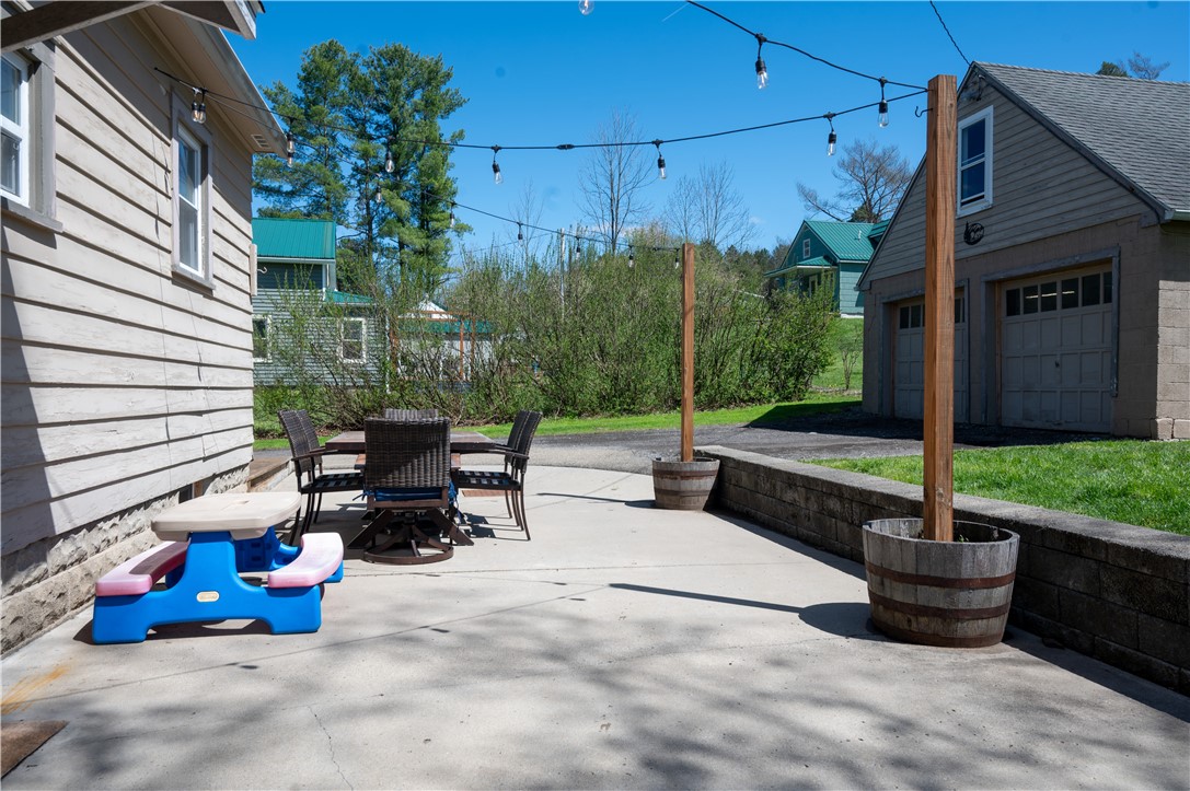 3365 Trapping Brook Road Wellsville, NY 14895 - Photo 32 of 47 The outdoor eatery or party patio, or both, is ready! The string lights make the space for your nighttime entertaining.