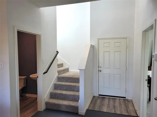 a view of entryway with wooden floor