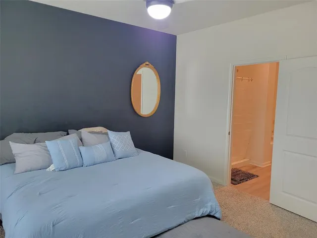 a bathroom with a sink a mirror and a shower