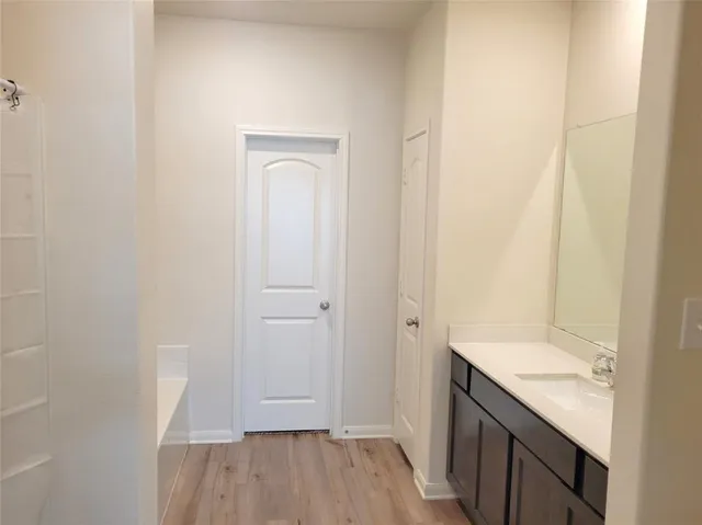 a bathroom with a tub and a shower curtain