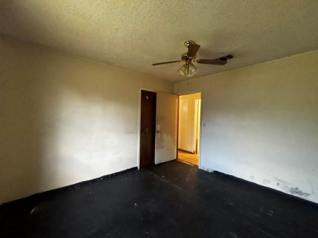 122 Rosa Street Edna, TX 77957 - Photo 17 of 17 a view of an empty room with wooden floor and a ceiling fan