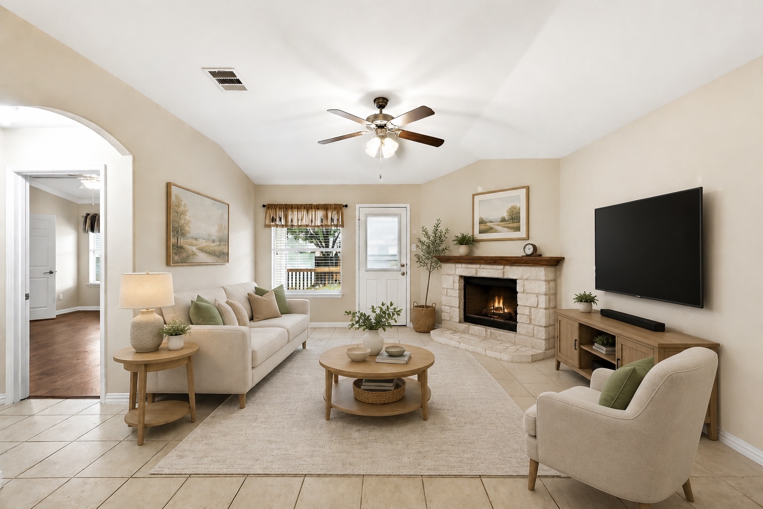 209 Calline Mayes Run Buda, TX 78610 - Photo 14 of 32 Virtually Staged living area featuring a stone fireplace with a wood mantle, a ceiling fan, and tile flooring