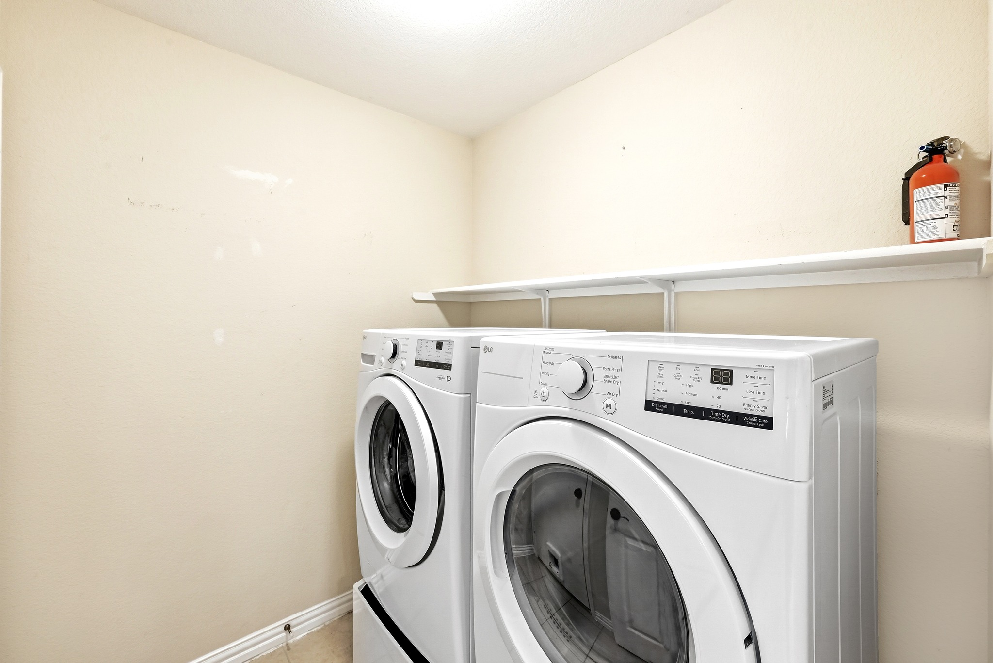 209 Calline Mayes Run Buda, TX 78610 - Photo 27 of 32 Laundry area with white walls, white ceiling, and white baseboards