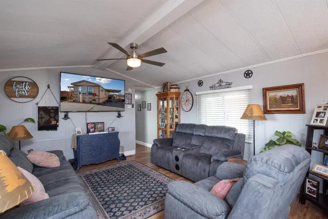 a living room with furniture and a rug