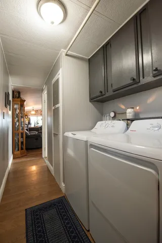 a kitchen with refrigerator and cabinets