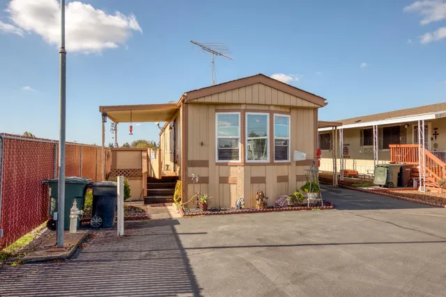 a front view of a house with glass windows