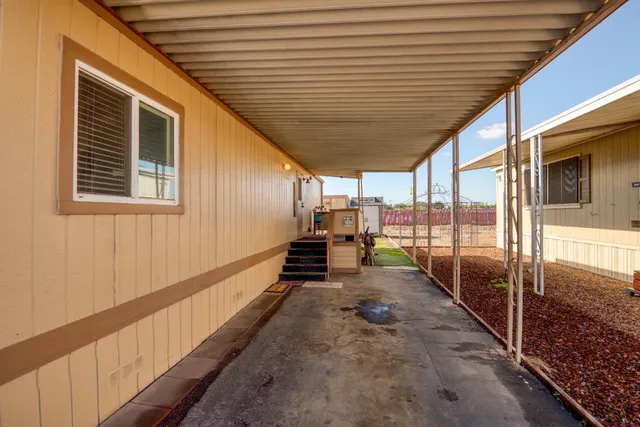 a view of a porch with wooden floor