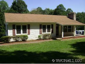 335 Osborne Ridge Road Canton, NC 28716 - Photo 1 of 9 a view of a house with a garden